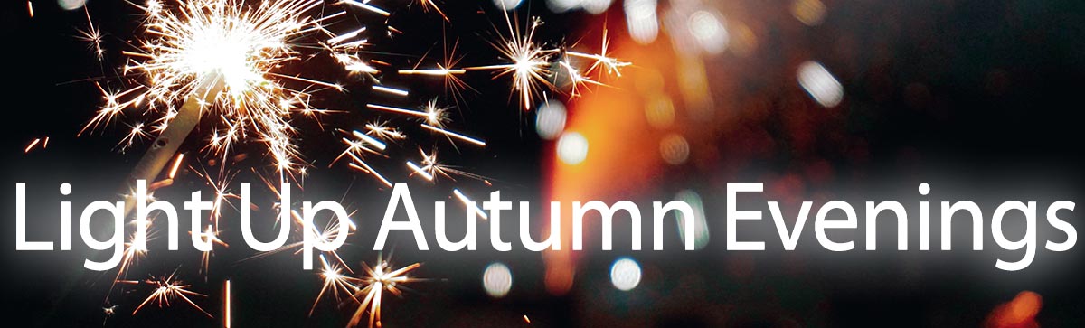 Text "light up autumn evenings" on a dark background with sparklers