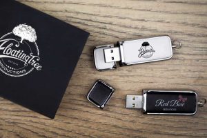 Branded USB Packaging with Branded Black and White Leather USBs